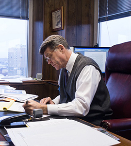 Kansas City attorney David M. Lurie at his desk, providing professional legal representation for international World Cup fans.